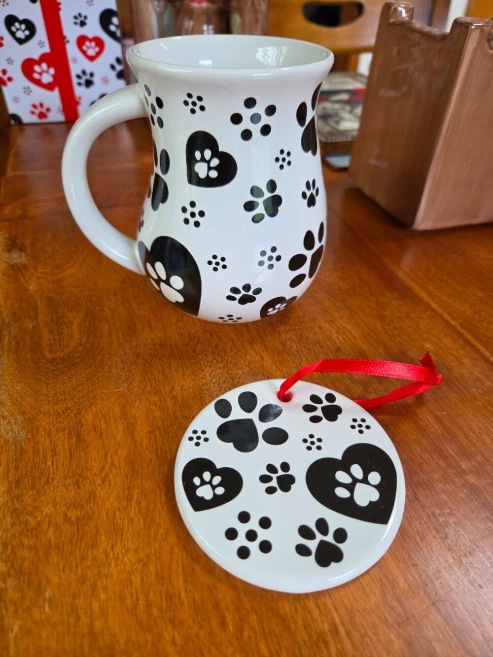 ceramic mug adorned with all over paw print and heart pattern temptations